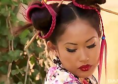 A red hot Japanese girl dressed in costume fingering her pussy