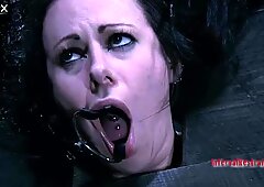 Submissive MILF slut Moxxie Maddron sucks a cock in a BDSM porn video
